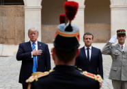 <p>French President Emmanuel Macron and President Donald Trump listen to national anthems as they review troops during a welcoming ceremony at the Invalides in Paris, France, July 13, 2017. (Photo: Yves Herman/Reuters) </p>