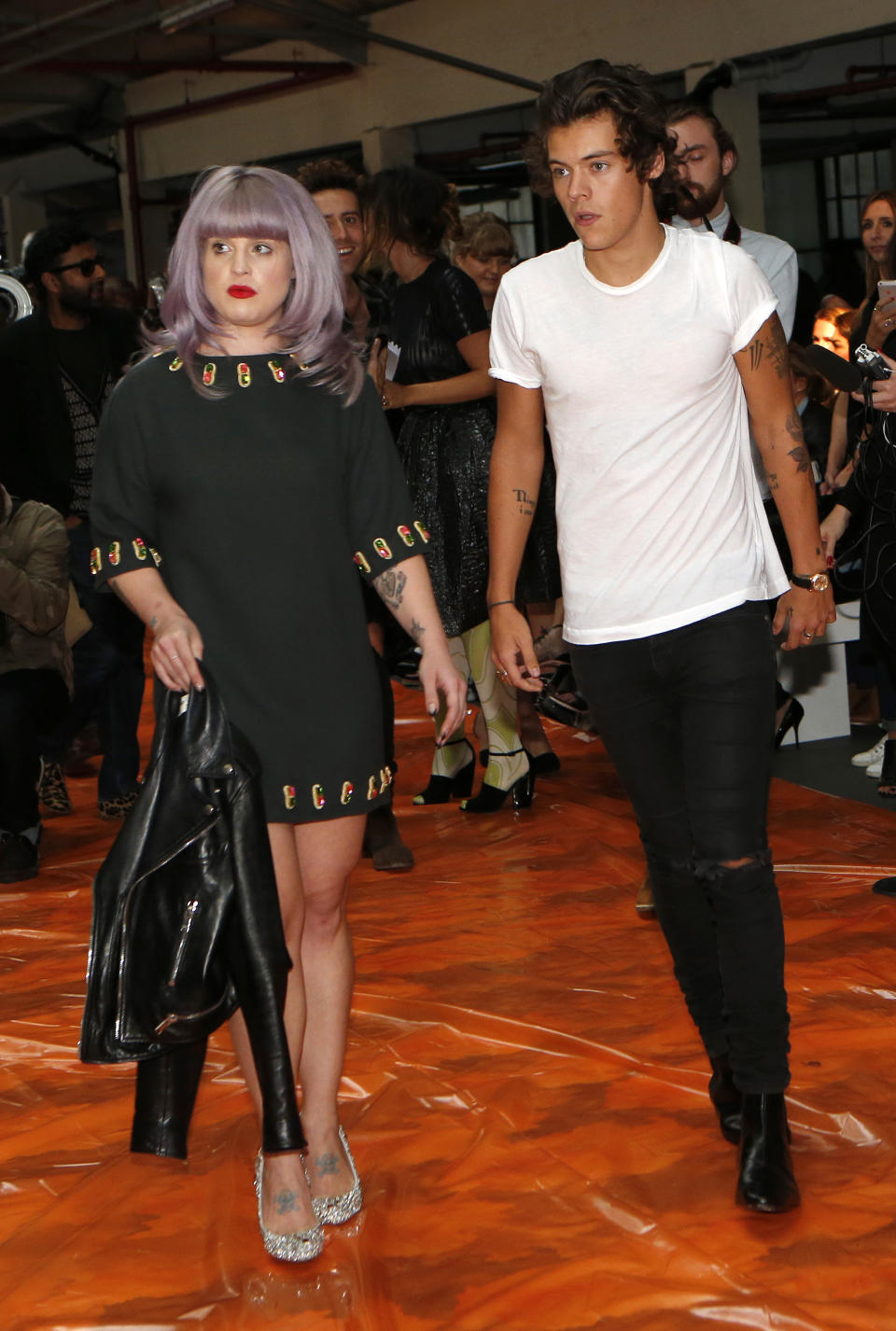 Actress Kelly Osbourne (L) and Harry Styles of the band One Direction arrive for the House of Holland Spring/Summer 2014 collection presentation during London Fashion Week September 14, 2013. REU TERS/Suzanne Plunkett (BRITAIN - Tags: FASHION ENTERTAINMENT)