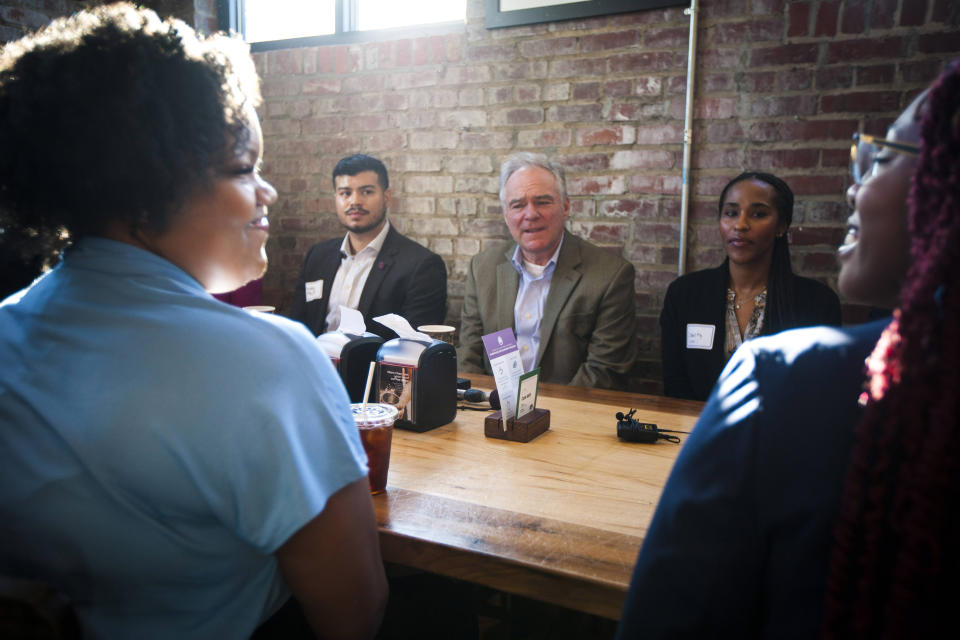 U.S. Sen. Tim Kaine, D-Va., center, speaks during an economic roundtable with young community leaders, Friday, Jan. 20, 2023, at Front Porch Cafe in Richmond, Va. Kaine, the 2016 Democratic vice presidential nominee and a fixture in Virginia politics for decades, said Friday that he would seek reelection next year, easing his party's worries about holding on to a seat in a state now led by a Republican governor. (AP Photo/John C. Clark)