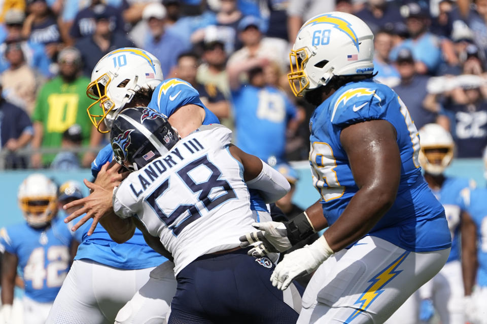 Los Angeles Chargers quarterback Justin Herbert (10) is sacked by Tennessee Titans linebacker Harold Landry III (58) during the second half of an NFL football game Sunday, Sept. 17, 2023, in Nashville, Tenn. (AP Photo/George Walker IV)