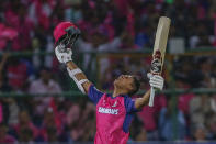 Rajasthan Royals' Yashasvi Jaiswal raises his bat as he celebrates after scoring a century during the Indian Premier League cricket match between Mumbai Indians and Rajasthan Royals in Jaipur, India, Monday, April 22, 2024. (AP Photo/Surjeet Yadav)