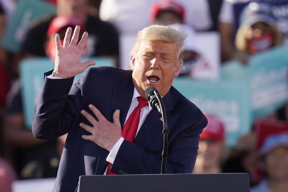 President Donald Trump gestures as he talks about Democratic presidential candidate former Vice President Joe Biden as he speaks at a campaign rally Monday, Oct. 19, 2020, in Tucson, Ariz. (AP Photo/Ross D. Franklin)