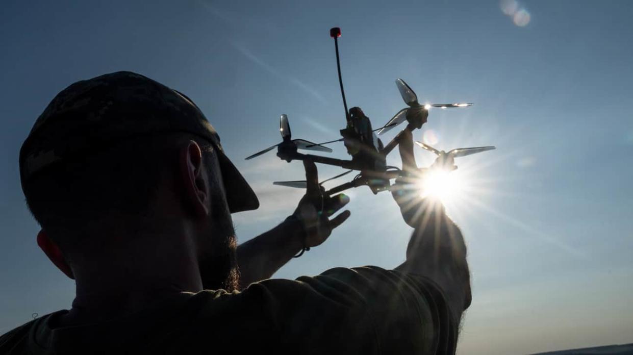 A Ukrainian soldier of 24th brigade prepares equipment of FPV drones. Stock photo: Getty Images