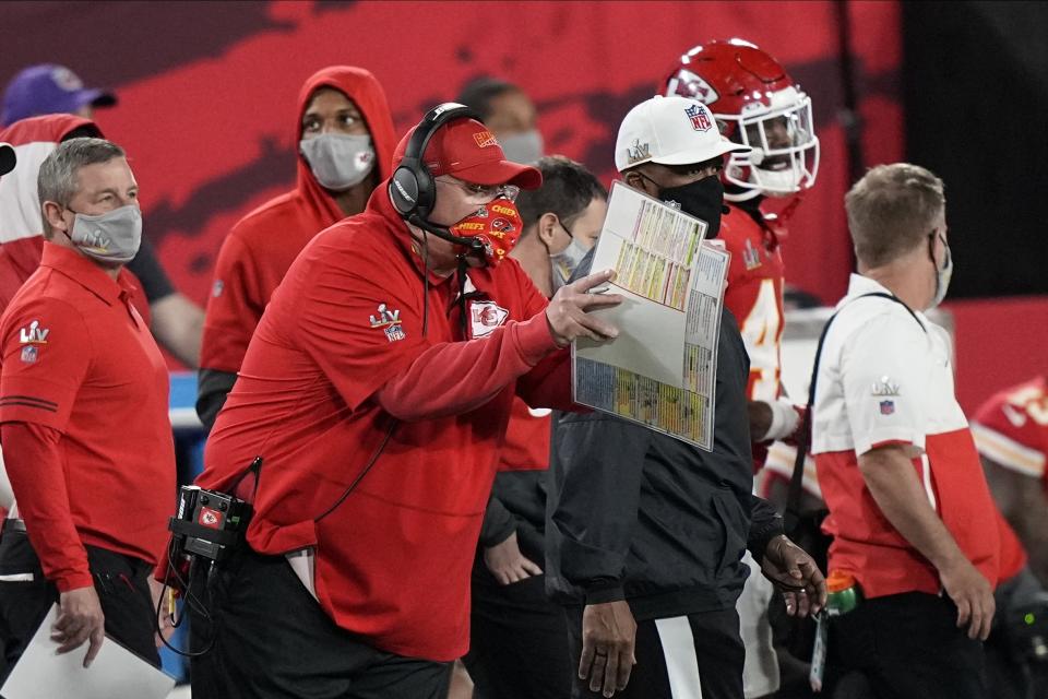 Kansas City Chiefs' Andy Reid works during the first half of the NFL Super Bowl 55 football game against the Tampa Bay Buccaneers Sunday, Feb. 7, 2021, in Tampa, Fla. (AP Photo/David J. Phillip)