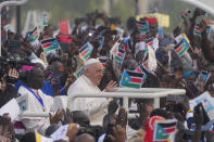 Pope Francis arrives to celebrate mass at the John Garang Mausoleum in Juba, South Sudan, Sunday, Feb. 5, 2023. Francis is in South Sudan on the second leg of a six-day trip that started in Congo, hoping to bring comfort and encouragement to two countries that have been riven by poverty, conflicts and what he calls a "colonialist mentality" that has exploited Africa for centuries. (AP Photo/Gregorio Borgia)