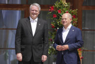German Chancellor Olaf Scholz, left, greets Secretary-General Organisation for Economic Co-operation and Development Mattias Cormann during the official welcome ceremony of G7 leaders and Outreach guests at Castle Elmau in Kruen, near Garmisch-Partenkirchen, Germany, on Monday, June 27, 2022. The Group of Seven leading economic powers are meeting in Germany for their annual gathering Sunday through Tuesday. (AP Photo/Matthias Schrader)