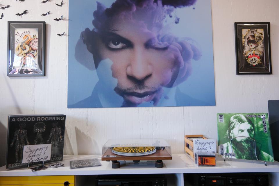 A poster of Prince hangs above the turntable Tuesday at High Fidelity record store on Sixth Avenue, located on the Historic Route 66 in Amarillo.