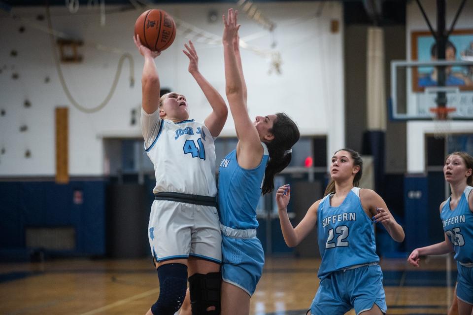 John Jay-East Fishkill's Ashley Buragas, left, shoots during the Section 1 girls basketball game in Wiccopee on Friday, February 17, 2023.