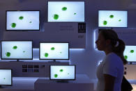 BERLIN, GERMANY - AUGUST 31: A visitor passes Panasonic ETW5 energy efficient Smart TV flat-screen televisions at the Internationale Funkausstellung (IFA) 2012 consumer electronics trade fair on August 31, 2012 in Berlin, Germany. IFA 2012 is open to the public from today until September 5. (Photo by Adam Berry/Getty Images)