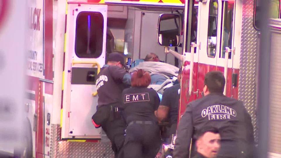 <div>A woman is loaded into an ambulance after a shooting at Skyline High. May 23, 2023</div>