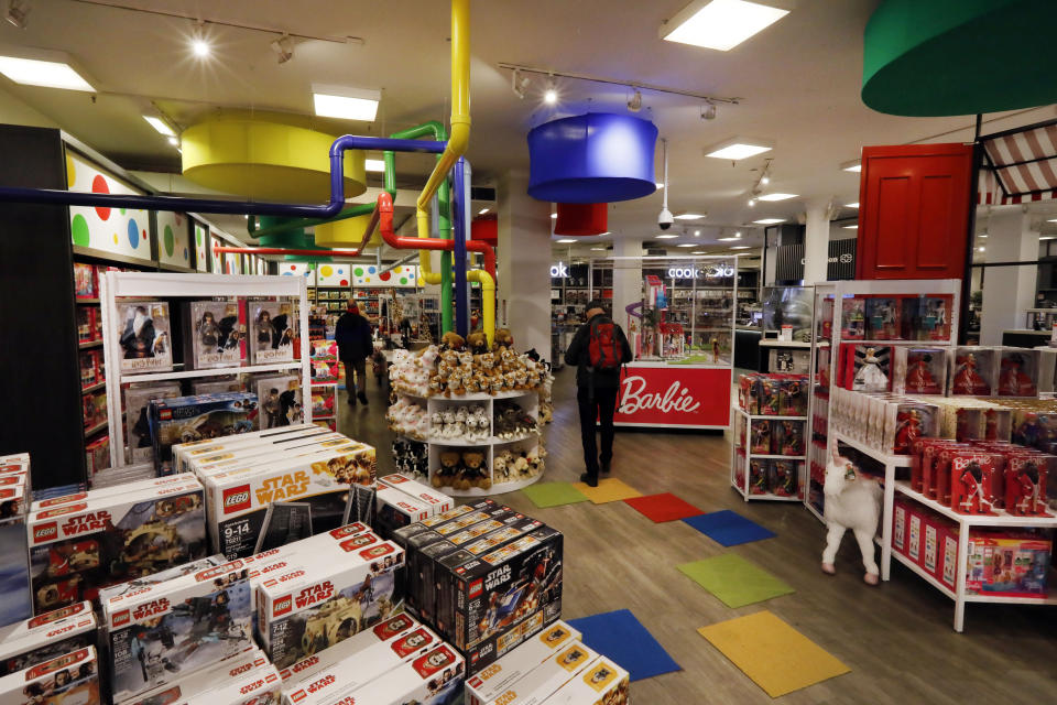 In this Tuesday, Nov. 5, 2019, photo shoppers browse the Fun & Games section at the Macy's flagship store in New York. With three weeks until the official start of the holiday shopping season, the nation’s retailers are gearing up for what will be another competitive shopping period. (AP Photo/Richard Drew)