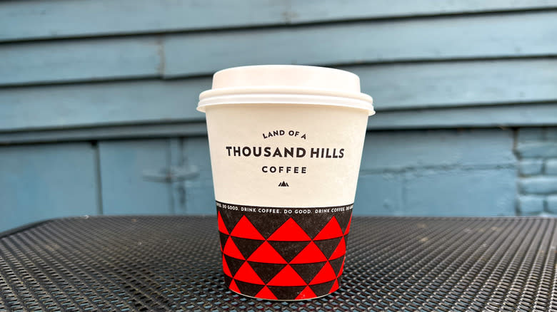 To-go cup of Land of a Thousand Hills hot chocolate