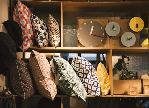 Home decor shop with pillows and clocks