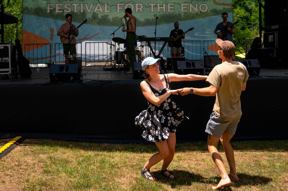 Sophie Lowry and Sam Finlay dance together during the Mellow Swellsí opening song at the Festival for the Eno on Saturday, July 2, 2022.