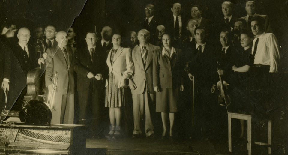 Leonard Bernstein with the members of the Ex-Concentration Camp Orchestra whom he conducted on May 10, 1948, outside Munich.