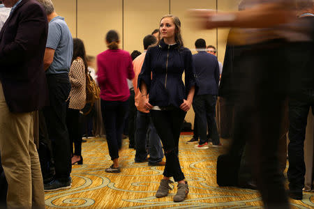 Millennial stock blogger and trader Rachel Fox, 20, stands in a reception room after speaking to a group of investors, tech nerds and stock traders at StockTwits annual Stocktoberfest in Coronado, California, U.S. October 14, 2016. Picture taken October 14, 2016. REUTERS/Mike Blake