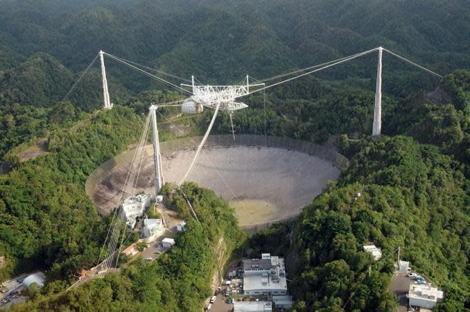 The 1,000-foot-wide Arecibo Observatory in Puerto Rico, one of the largest single-dish radio telescopes in the world, is set for demolition after cable failures that left its 900-ton instrument platform in danger of an uncontrolled collapse. / Credit: University of Central Florida