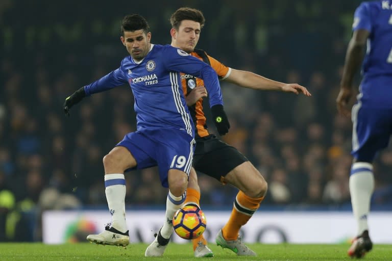 Chelsea's Brazilian-born Spanish striker Diego Costa (L) vies with Hull City's English defender Harry Maguire during the English Premier League football match between Chelsea and Hull City at Stamford Bridge in London on January 22, 2017