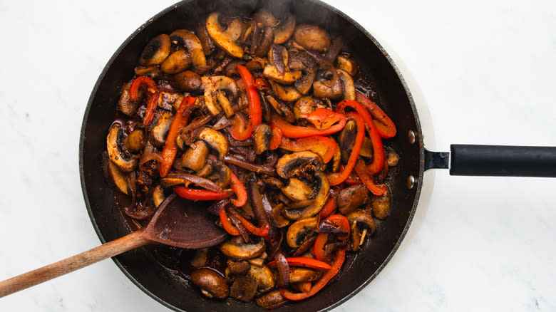 Vegetables frying in pan