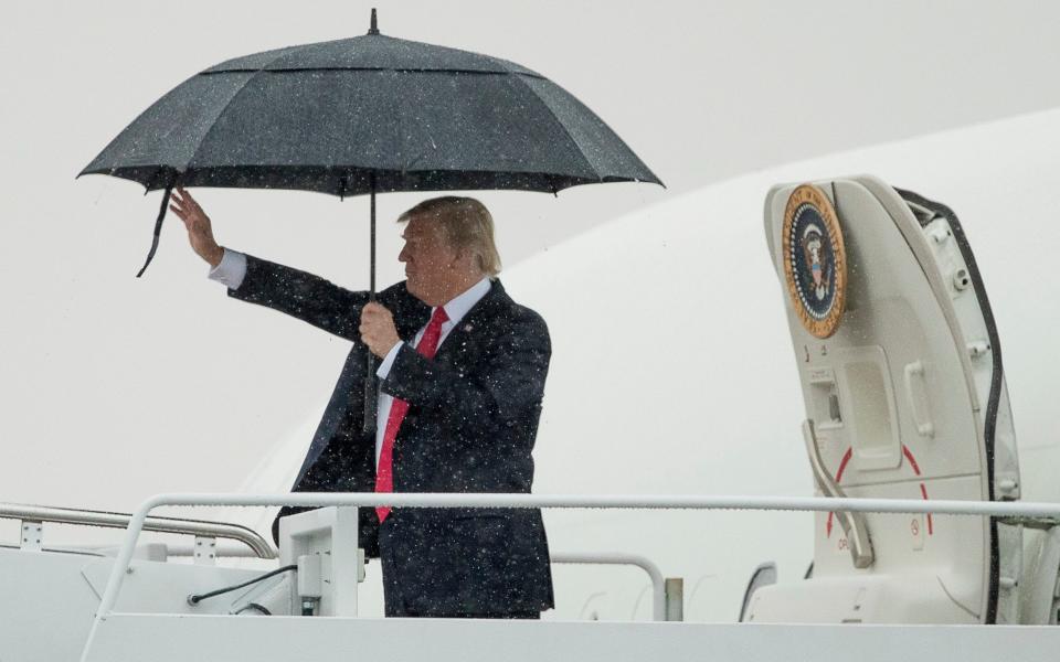 President Donald Trump waves before boarding Air Force One at Andrews Air Force Base, Md., Friday, July 28, 2017, en route to Brentwood, N.Y. close to where the ultra-violent street gang MS-13 has committed a string of gruesome murders - Credit: AP