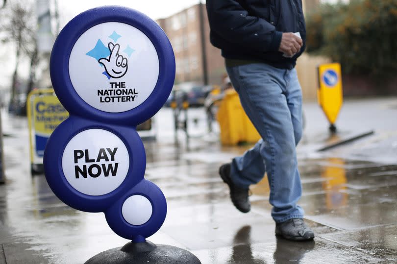 A National Lottery sign outside a newsagent