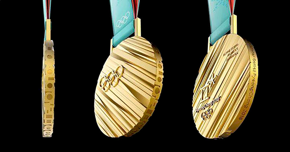 <p>The medals for the 2018 Winter Olympics were inspired by Hangeul, the Korean alphabet. Viewed from the side, Korean consonants spell ‘<a rel="nofollow noopener" href="https://www.pyeongchang2018.com/en/medal" target="_blank" data-ylk="slk:Olympic Winter Games PyeongChang 2018;elm:context_link;itc:0;sec:content-canvas" class="link ">Olympic Winter Games PyeongChang 2018</a>.’ The gold medal weighs 586 grams (1.29 pounds)–believed to be the <a rel="nofollow noopener" href="http://olympics.nbcsports.com/2017/09/20/pyeongchang-olympic-medals-unveiled/" target="_blank" data-ylk="slk:heaviest;elm:context_link;itc:0;sec:content-canvas" class="link ">heaviest</a> in Olympic history.<br> (Photo via Facebook/swna) </p>