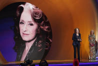 Bonnie Raitt accepts the award for song of the year for "Just Like That" at the 65th annual Grammy Awards on Sunday, Feb. 5, 2023, in Los Angeles. First Lady Jill Biden looks on from right. (AP Photo/Chris Pizzello)