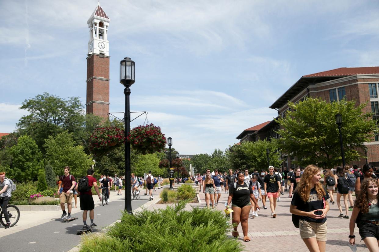 Students walk across Purdue University's campus, Monday, Aug. 23, 2021 in West Lafayette.