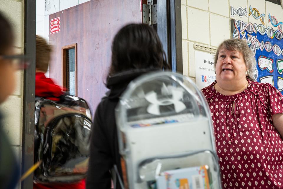 Science teacher Cynthia Hopkins stands outside of her classroom and welcome in students at Kaffie Middle School on Monday, Oct. 2, 2023, in Corpus Christi, Texas.