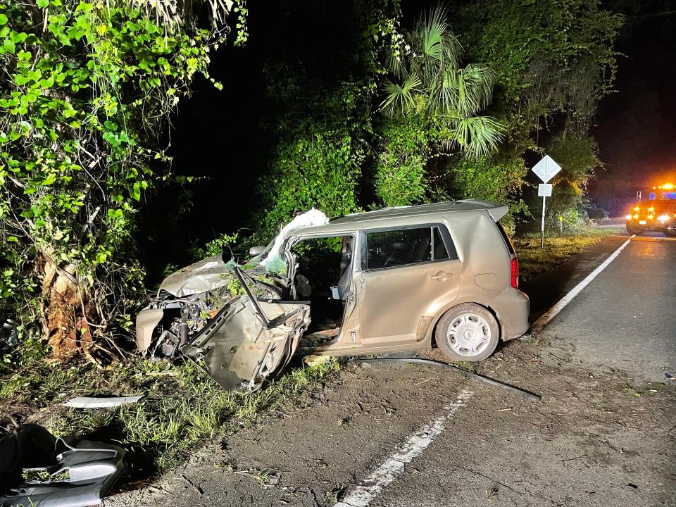 Troopers said a woman was driving this Toyota Scion when it struck a tree, killing her.