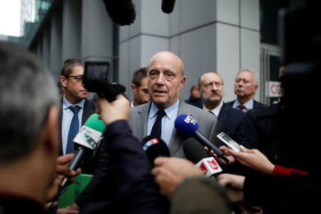 French politician Alain Juppe, current mayor of Bordeaux, a member of the conservative Les Republicains political party and candidate for their presidential primary, speaks to journalists during a visit at the stock market operator Euronext headquarters in La Defense business and financial district in Courbevoie near Paris, near Paris, France, October 25, 2016. REUTERS/Benoit Tessier