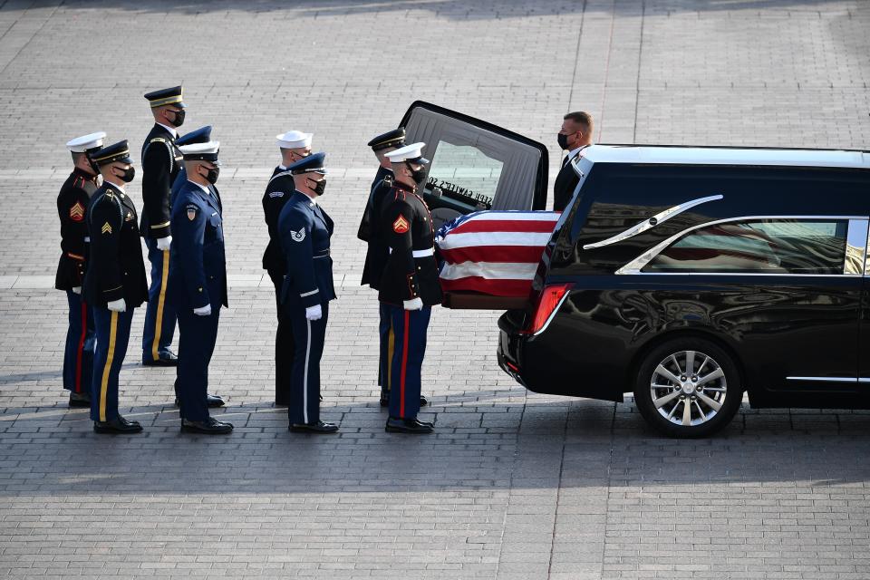 A joint forces military bearer team prepares to move the casket of former Sen. Bob Dole as it arrives at the U.S. Capitol in Washington, where he will lie in state, Thursday, Dec. 9, 2021. (Mandel Ngan/Pool via AP)