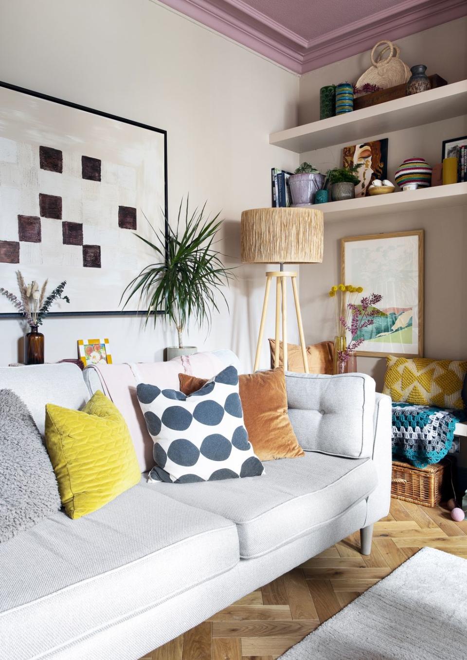 living room in soft pink with off white modern sofa