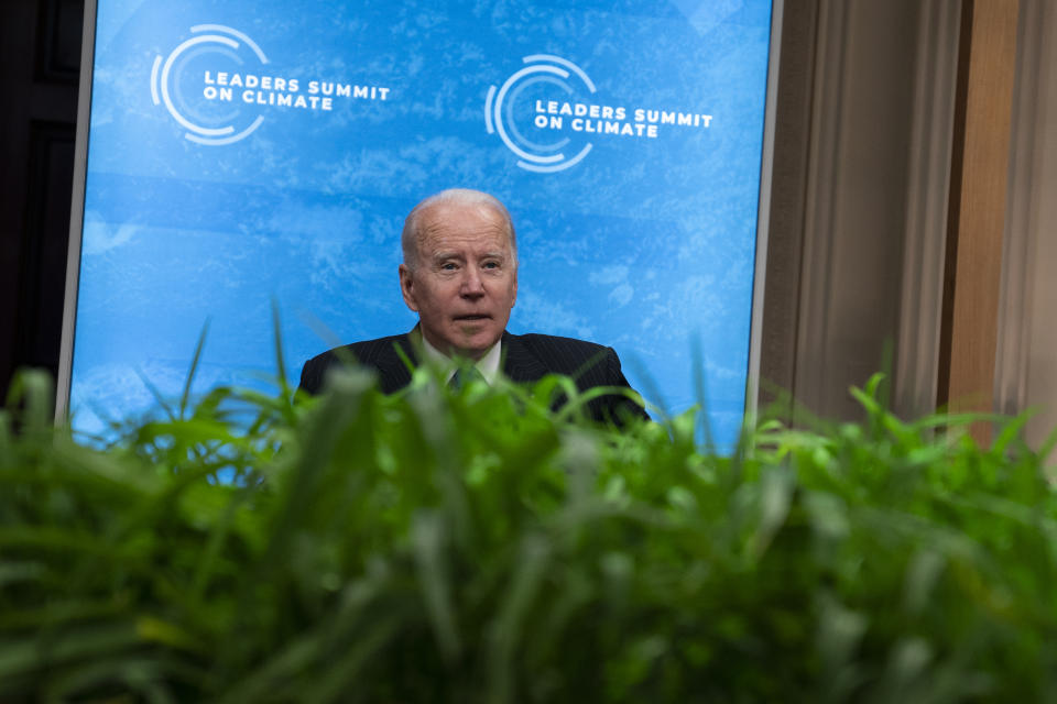 President Joe Biden sits down after speaking to the virtual Leaders Summit on Climate, from the East Room of the White House, Friday, April 23, 2021, in Washington. (AP Photo/Evan Vucci)