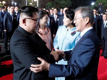 South Korean President Moon Jae-in, North Korean leader Kim Jong Un, Kim's wife Ri Sol Ju and Moon's wife Kim Jung-sook attend a farewell ceremony at the truce village of Panmunjom inside the demilitarized zone separating the two Koreas, South Korea, April 27, 2018. Korea Summit Press Pool/Pool via Reuters - RC17FA95F0D0