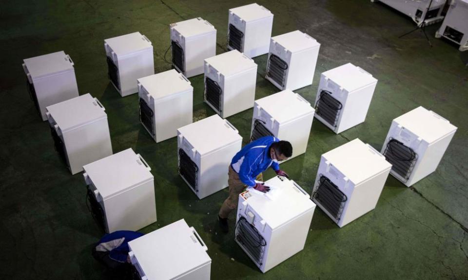 A manager at fridge manufacturer Kanou Reiki checks deep freezers that will be used to store Covid vaccines at the company’s warehouse in Sagamihara, Kanagawa prefecture