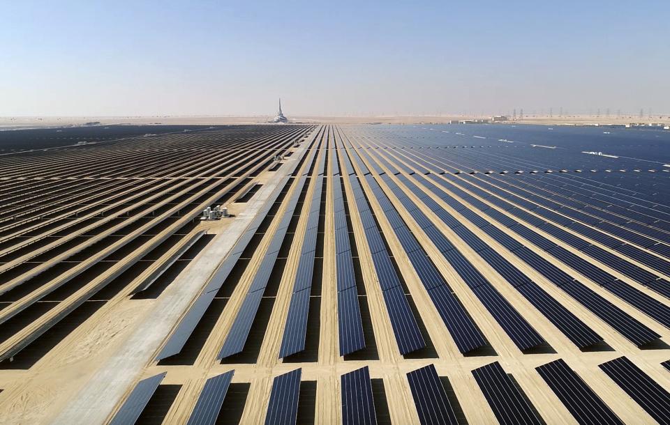 This screenshot from undated footage released by Strategy & Government Communications of Dubai, shows the Mohammed bin Rashid Al Maktoum Solar Park, about 50 kilometres south of Dubai, United Arab Emirates. In the oil-rich UAE, an unusual sight is rising in Dubai -- a coal-fired power plant, a first for the region. The $3.4 billion Hassyan power plant in Dubai appears puzzling as the UAE hosts the headquarters of the International Renewable Energy Agency. (Strategy & Government Communications of Dubai via AP)