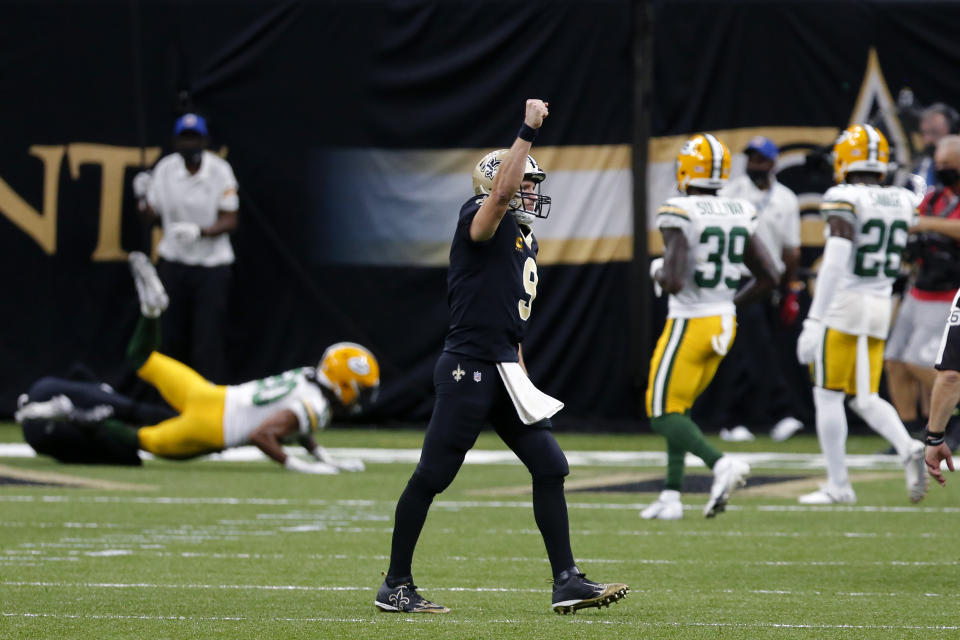 New Orleans Saints quarterback Drew Brees (9) celebrates after throwing a touchdown pass to wide receiver Emmanuel Sanders in the first half of an NFL football game against the Green Bay Packers in New Orleans, Sunday, Sept. 27, 2020. (AP Photo/Brett Duke)