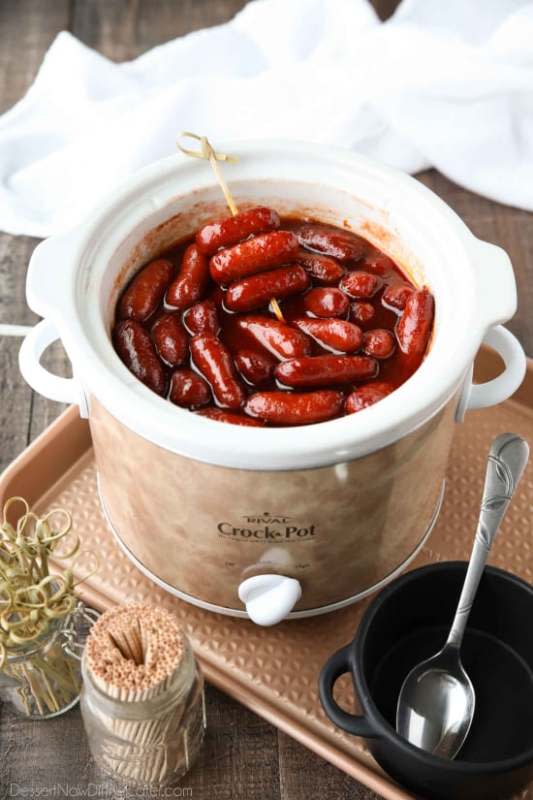 <p>Dessert Now Dinner Later</p><p>Crockpot Little Smokies is an easy appetizer for parties, the big game or holidays. Only three ingredients and a slow cooker are all you need for these cocktail sausages. The sweet and tangy sauce is great on meatballs too! </p><p><a href="https://www.dessertnowdinnerlater.com/crockpot-little-smokies/" rel="nofollow noopener" target="_blank" data-ylk="slk:Get the Recipe;elm:context_link;itc:0;sec:content-canvas" class="link ">Get the Recipe</a></p>