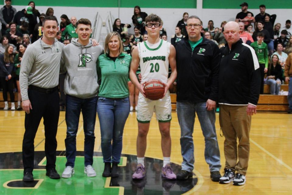 From left, Pembroke coach Matt Shay, Cayden Pfalzer, Jaime Totten, Tyson Totten, Jamie Totten and JV coach Cory Coe. Tyson Totten broke Pembroke's all-time scoring record, previously held by Pfalzer, on Friday.