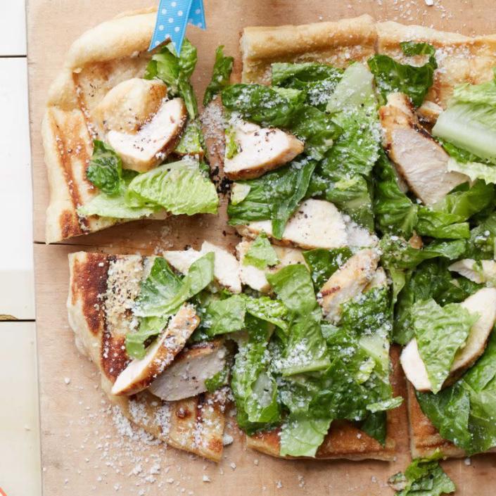 <p>Top a slice of chewy flatbread with chicken salad and you've got yourself an easy, hearty dinner.</p><p><a href="https://www.womansday.com/food-recipes/food-drinks/recipes/a54829/grilled-caesar-salad-flatbread-recipe/" rel="nofollow noopener" target="_blank" data-ylk="slk:Get the recipe for Grilled Caesar Salad Flatbread." class="link rapid-noclick-resp"><u><u><em>Get the recipe for Grilled Caesar Salad Flatbread.</em></u></u></a></p>
