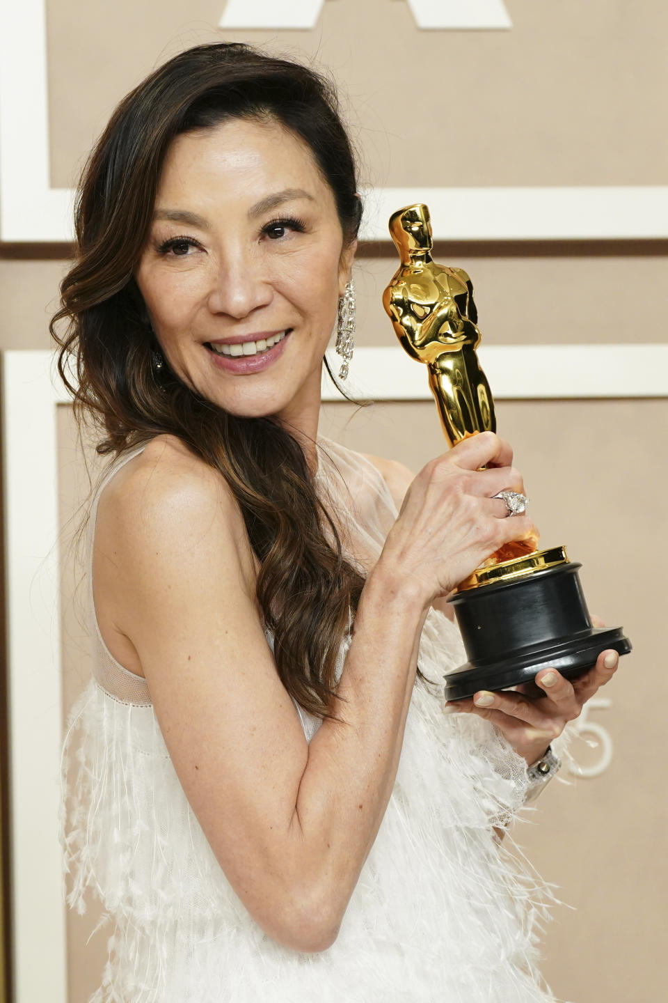 Michelle Yeoh, winner of the award for best performance by an actress in a leading role for "Everything Everywhere All at Once," poses in the press room at the Oscars on Sunday, March 12, 2023, at the Dolby Theatre in Los Angeles. (Photo by Jordan Strauss/Invision/AP)
