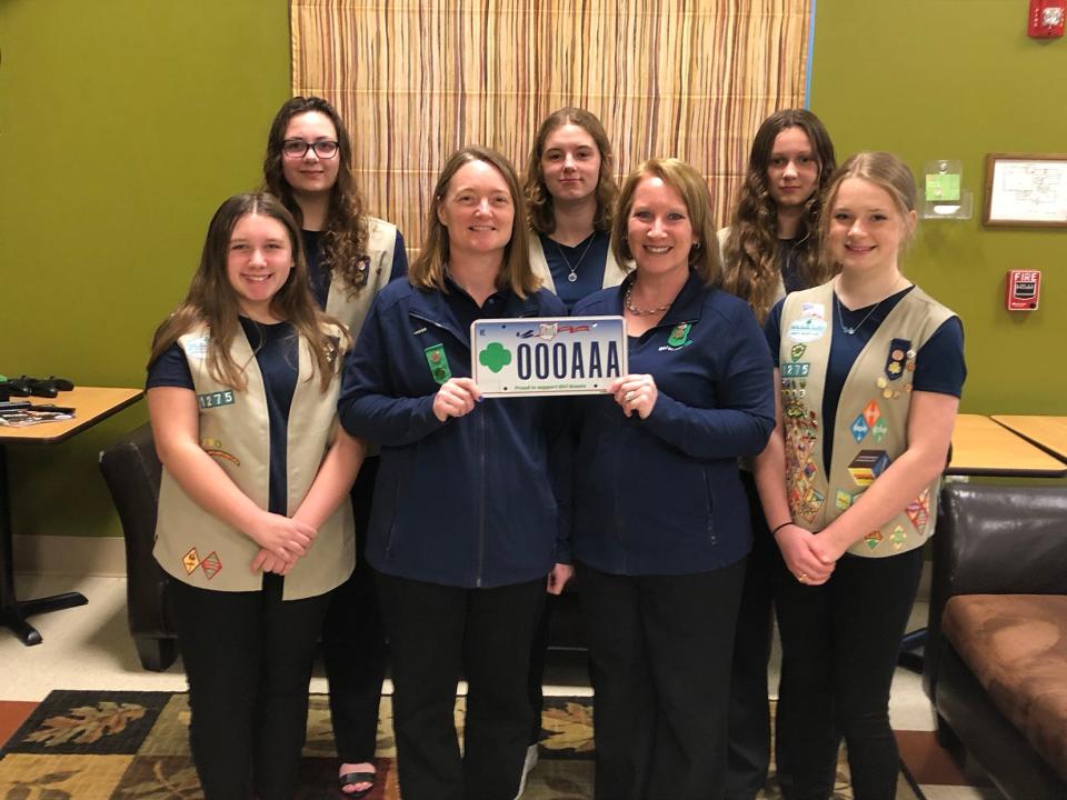 A new specialty license plate came to fruition thanks to the efforts of Girl Scouts from Troop 1275 in Richland County. Front, from left: Olivia Prosser, Christel Koppert-Smith, Jennifer Washburn, Skyler Washburn. Back: Kylee Gearheart, Estella Koppert-Smith, Naomi Gearheart.