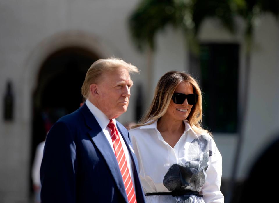 Donald and Melania Trump stand in front of members of the media after casting their votes at the Morton and Barbara Mandel Recreation Center on elections day March 19, 2024 Palm Beach.