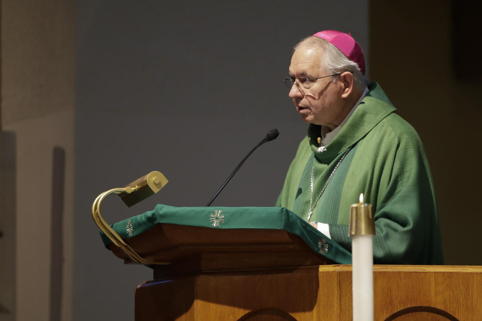 Jose Gomez, Archbishop of Los Angeles, leads a service at the San Gabriel Mission Sunday, July 12, 2020, in San Gabriel, Calif. A fire on Saturday destroyed the rooftop and most of the interior of the nearly 250-year-old California church that was undergoing renovation. (AP Photo/Marcio Jose Sanchez)