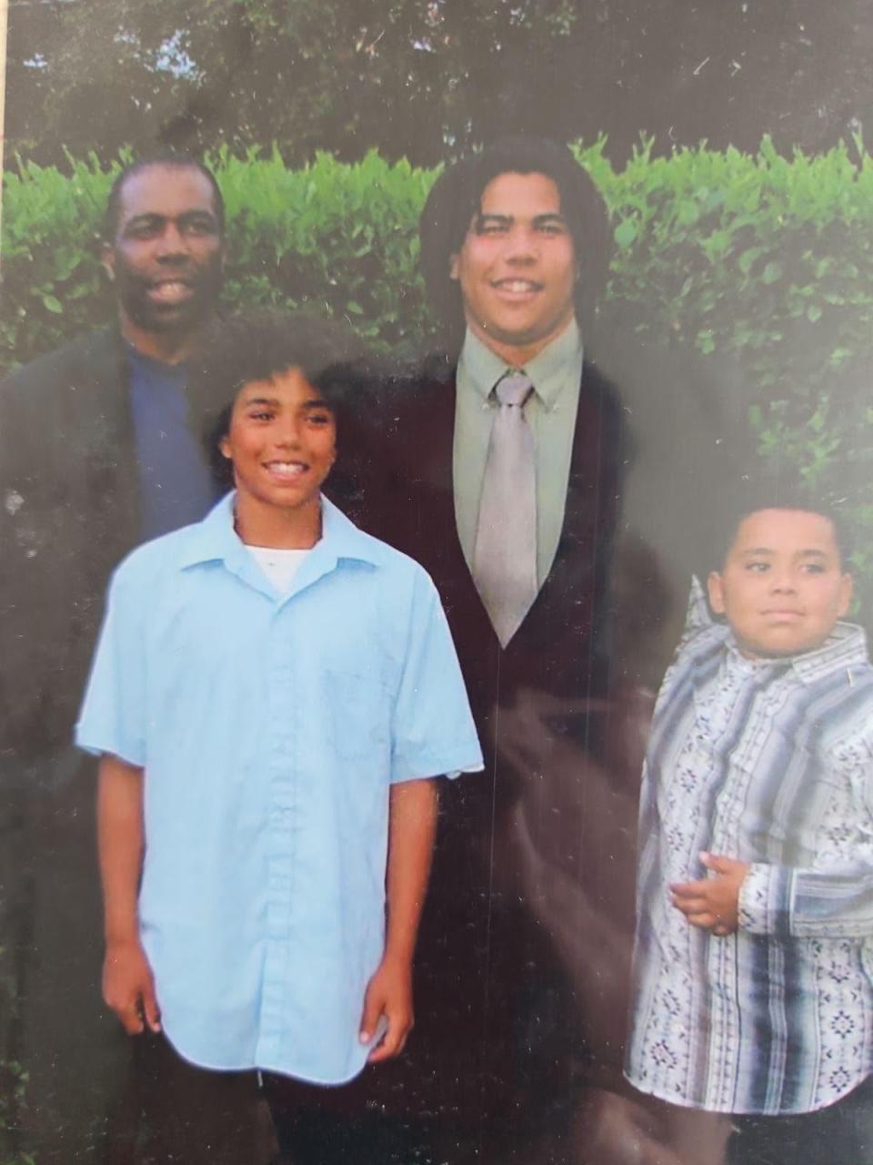 The Mthembu brothers pictured with their father. The brothers say they were often treated differently growing up Black in a small town in Saskatchewan. 