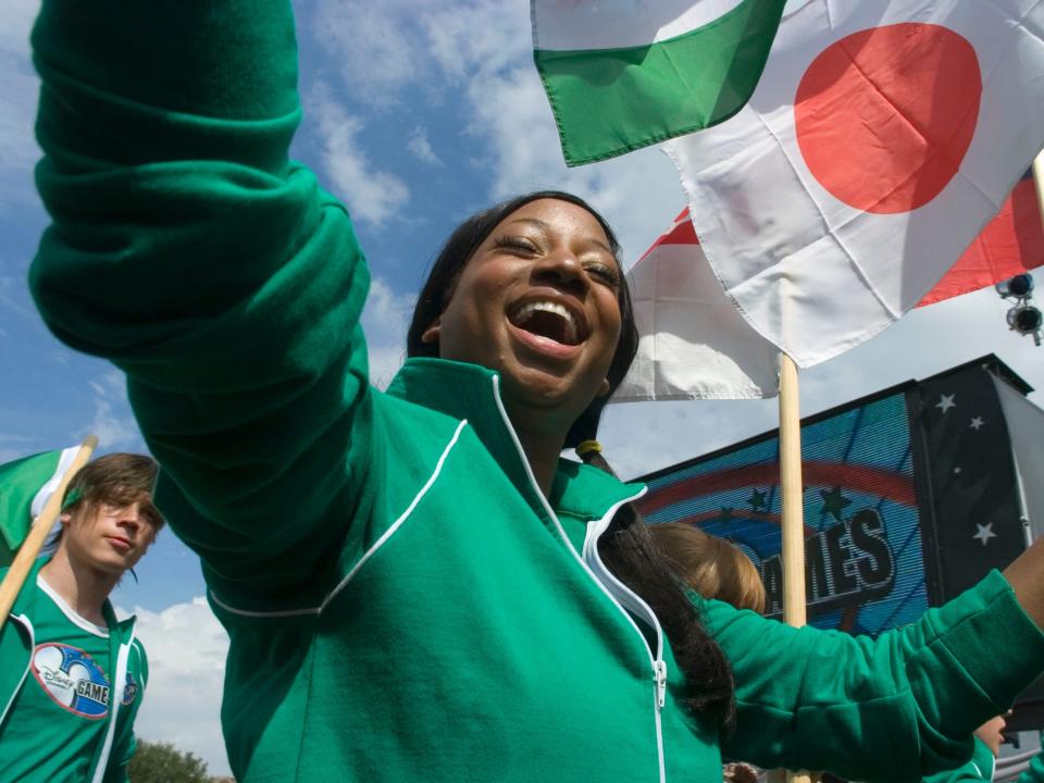 monique coleman in green smiling at the disney channel games 2007