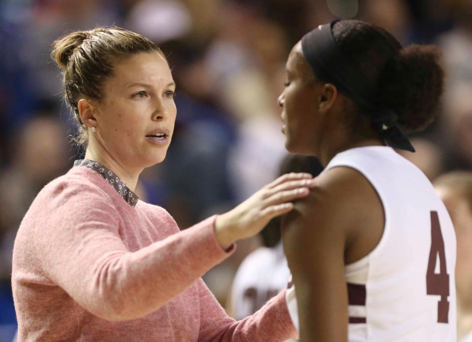 Caravel coach Kristin Caldwell advises Sasha Marvel in a break in the first half of the DIAA state tournament championship game at the Bob Carpenter Center Friday.