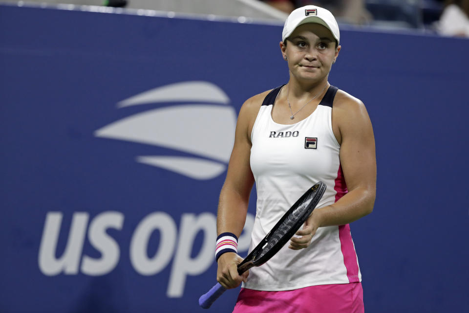 FILE - In this Aug. 28, 2019, file photo, Ashleigh Barty, of Australia, reacts against Lauren Davis during the second round of the U.S. Open tennis tournament in New York. Barty has joined the ranks of high-profile players concerned over the staging of the U.S. Open while there’s still so much uncertainty around the coronavirus pandemic. “I have concerns too,” Barty said in an e-mail to The Associated Press. “I understand the tournaments are eager to run but keeping everyone safe has to be the priority.” (AP Photo/Adam Hunger, File)