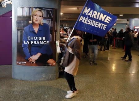 A supporter for Marine Le Pen, French National Front (FN) political party leader and candidate for French 2017 presidential election, attends a campaign rally in Nice, France, April 27, 2017. REUTERS/Eric Gaillard